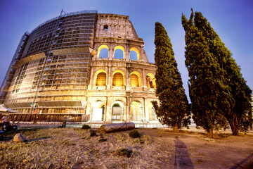 Fototapeta premium The Colosseum and the homonymous square at summer sunset, Rome, Italy