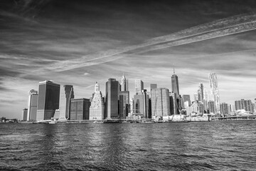 Downtown Manhattan skyline from Brooklyn Bridge Park - New York City at sunset
