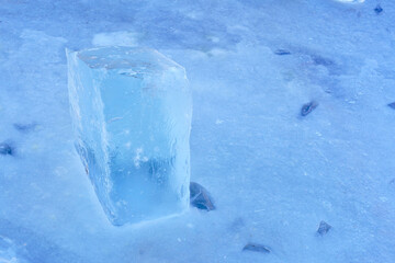 Fresh ice cube on the river as a material for building ice sculptures in winter