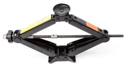 Black metal jack for replacing a car wheel on a white isolated background in a car service. Equipment in the trunk and in the garage.