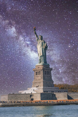 Fototapeta premium The Statue of Liberty under a starry night, New York City - USA