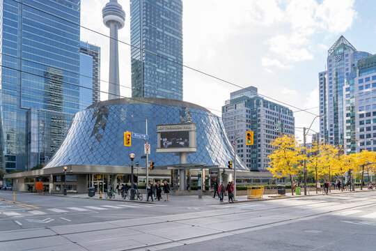 Toronto, Canada - October 24, 2019: Roy Thomson hall in fall with CN tower in background in Toronto, Canada. Roy Thomson Hall is a concert hall in Toronto.