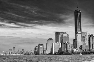 Fototapeta premium Amazing sunset colors of Lower Manhattan skyline from the ferry boat, New York City