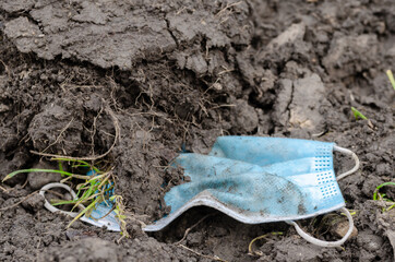 Forgotten  or  discarded surgical mask on ground