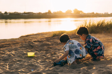Portrait of happy Two little boy on summer beach vacation