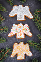Fresh baked gingerbread with colorful decorations and spruce branches. Christmas time