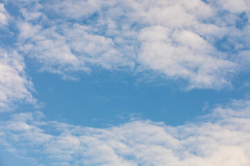 White clouds on the blue sky for background.