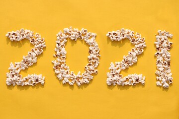 2021 Written with Popcorn on Yellow Background, Creative Photo of Happy New Year 2021, Perfect for...