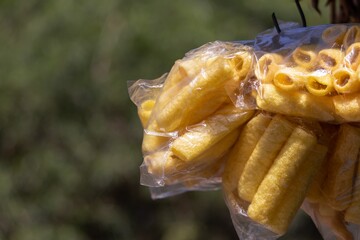 Fried Finger Fryum in Packs for Selling with Selective Focus