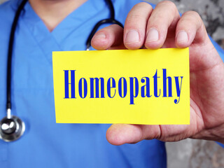 Health care concept meaning Homeopathy with inscription on the sheet.