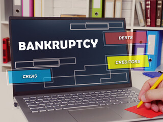  Financial concept meaning  bankruptcy debts creditors crisis with inscription on the page.