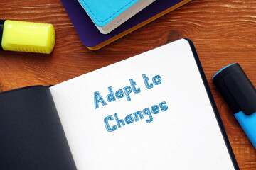 Adapt to Changes inscription on the piece of paper.