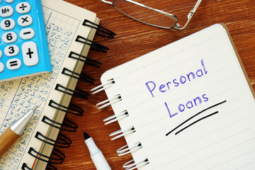 Business concept meaning Personal Loans with inscription on the sheet.