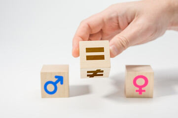 gender equality concept on wooden cubes. Concepts of gender equality. Hand flip wooden cube with...