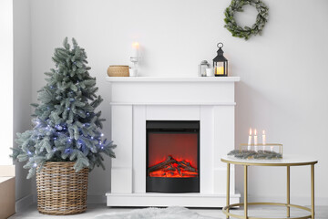 Interior of room with fireplace decorated for Christmas