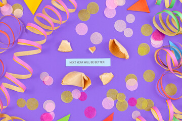 Motivational New Year celebration concept with open fortune cookie and text 'Next year will be...