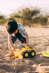 Portrait of happy little boy on summer beach vacation