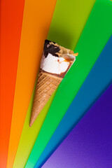 Ice-cream cone on a bright rainbow background
