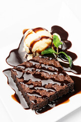 vegan chocolate brownie dessert with dairy-free vanilla ice cream