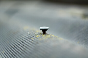 Photo of nail in the slate sheet