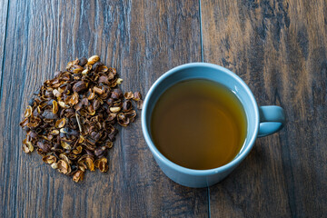 Cascara or Coffee Cherry Tea in Cup. Sun-Dried Peeled Coffee Beans.