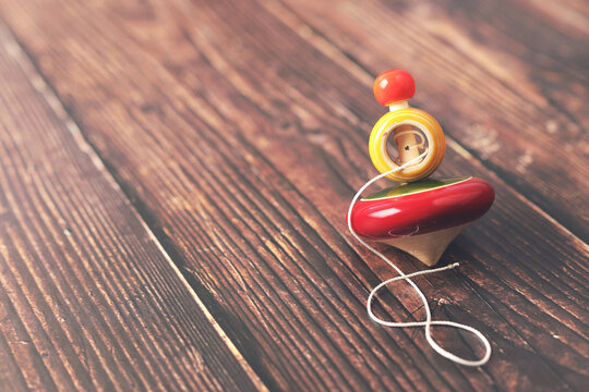 Handmade Indian traditional wooden spinning top toy with string	

