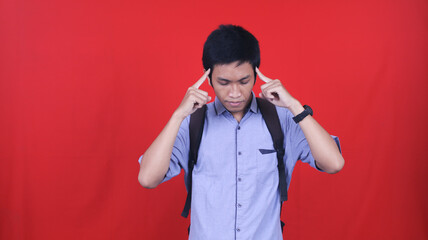 Asian man college student thingking and get ideas isolated red background