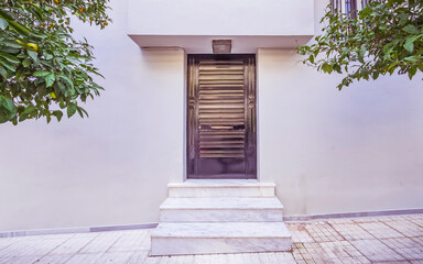 Contemporary house entrance black painted metal door, Athens Greece