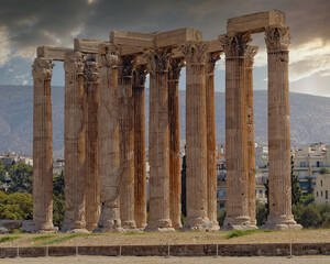 Fototapeta premium impressive columns of the ancient Olympian Zeus temple under dramatic sky, Athens Greece