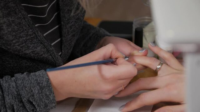 Christmas tree nail drawing manicure closeup