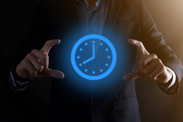 Businessman hand holds the icon of hours clock with arrow. Rapid execution of the work.Business...