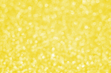 Illuminating Pantone Color Of The Year 2021. Abstract festive bokeh background with shining defocus sparkles. Blurred glitters shimmering dust macro close up, copy space for text logo