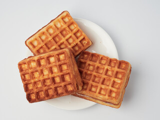 Traditional Belgian waffles isolated on white background, top view
