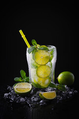   Refreshing summer alcoholic cocktail mojito with ice, fresh mint and lime. Copy Space.