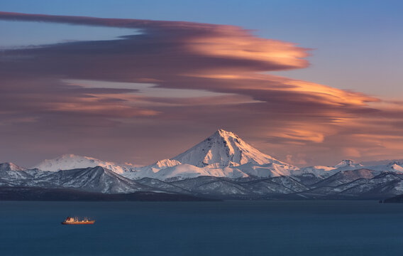 Kamchatka, lenticular clouds over the Vilyuchinsky volcano and the water area of Avachinsky bay