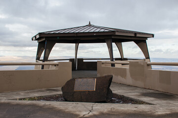 An unusual gazebo on the top of the mountain, from which you can see a beautiful view of the city, fields, forests from above. Oregon scenic highway. 