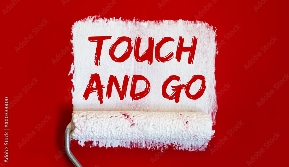Poster touch and go one open can of paint with white brush on it on red background. top view. repairing con