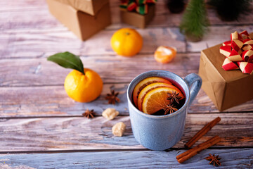 Mulled wine with oranges and anise in a cup