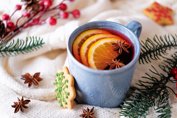 Mulled wine with oranges and anise in a cup
