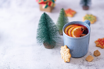 Mulled wine with oranges and anise in a cup