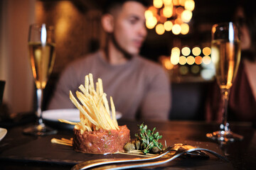 Couple having a meal at restaurant.