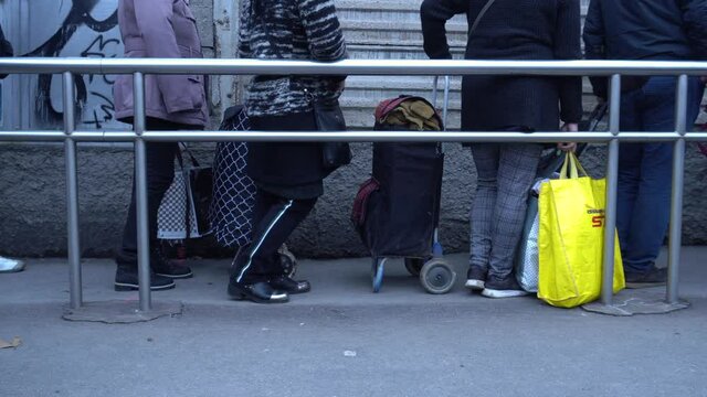 Europe, Italy , Milan December 2020, poor Italian and foreign people with masks lined up at Pane Quotidiano for free food during Covid-19 Coronavirus, increase in unemployed people and economic crisis