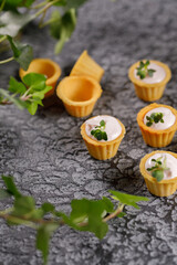 Canapes with light cream filling. Still life with microgreens. The concept of an appetizing snack.