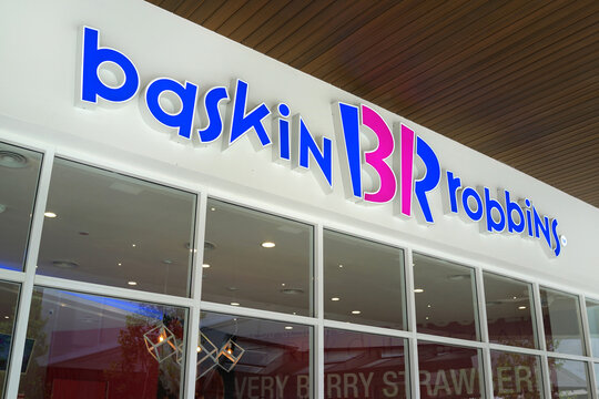 Baskin Robbins sign is attached to the exterior wall over the entrance to one of their retail stores in Design Village Outlet Mall Penang. PENANG, MALAYSIA - MAY 24, 2017.