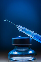 vaccine and syringe medical in blue enviroment