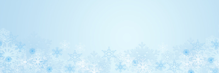 Fototapeta na wymiar Pastel blue winter background with snowflakes, copy space