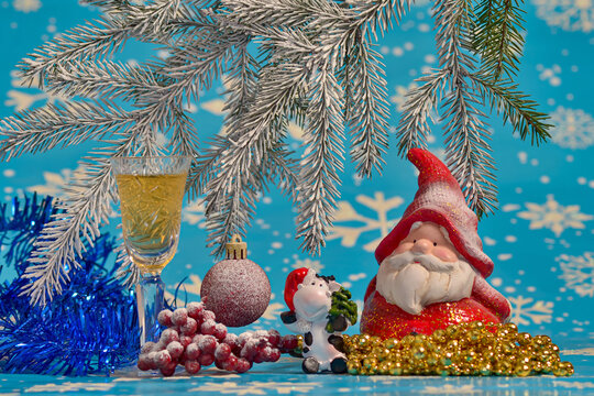 New Year's still life with decorations, Santa Claus and a glass of champagne