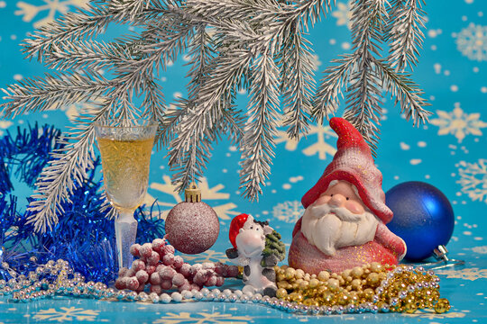 New Year's still life with decorations, Santa Claus and a glass of champagne