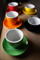 Multicolor empty coffee cup display on a shelf