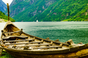 Old viking boat on fjord shore, Norway